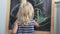 Little girl draws chalk on a blackboard