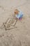 Little girl draws in the sand