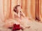 little girl dressed as a ballerina in a tutu indoor