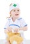 Little girl dressed as nurse bandages head to toy rabbit