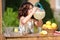 Little girl drinking from lemonade pitcher