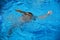 Little girl drowning in water while swimming in the pool or sea