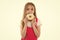 Little girl eat donut isolated on white. Child with glazed ring doughnut. Kid with junk food. Food for snack and dessert