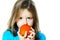 Little girl eating date plum, closeup view