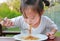 Little girl eating Japanese yakisoba noodles