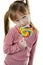 Little girl eating a lollipop