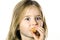 Little girl eating mandarin, closeup view