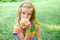 Little girl eating peach