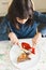 Little girl eating pork chop with peppers