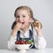 Little girl eating strawberry