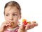 Little girl eating toy miniature burger