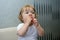 Little girl eating watermelon, two hands shoves in his mouth sweet watermelon