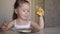 Little girl eats pancakes in the morning healthy breakfast. Healthy foods for child nutrition