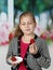 Little girl eats strawberry