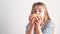 A little girl eats a sweet pear. Healthy fruit snacks at home, child eating fruit.