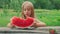 Little girl eats watermelon. Portrait of child eats watermelon slices.