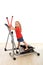 Little girl on elliptical trainer