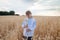 Little girl  in   embroidered shirt on   wheat field