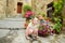 Little girl exploring old medieval streets of famous Civita di Bagnoregio village, located on top of a volcanic tuff hill, Lazio,