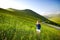 Little girl exploring the Piano Grande, large karstic plateau of Monti Sibillini mountains and one of the greatest tourist