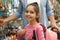 Little girl with father choosing school stationery