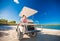 Little girl with father golf cart on tropical