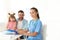 Little girl with father visiting children`s doctor in hospital