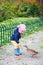 Little girl feeding duck