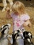 Little Girl Feeding Goats