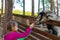 Little girl feeds a goat on the farm. Cute kind child feeds animals in the zoo.