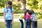 Little girl feeling left out in park