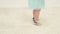 Little girl feet on the white carpet close-up