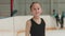 Little girl figure skater skating to the camera and smiling