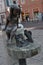 Little girl with fish bronze monument in the city of Lodz in Poland