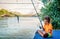 Little girl fishing on the river Bojana in Montenegro
