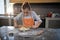 Little girl flattening dough on the kitchen counter