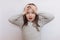 Little girl with flowing hair in light clothes grabbed his hands behind his head