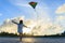 Little girl flying a kite