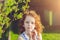 Little girl folded her hands a heart shaped, background toning fo