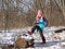 Little girl in the forest in wintertime