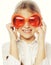 Little girl with fun orange carnaval glasses