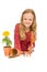 Little girl with gardening tools and potted flower