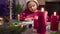 Little girl glues New Year card