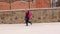 Little girl goes to school in the snow having fun. Walking during a snowstorm