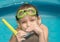 Little girl with goggles and snorkel
