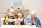 Little girl with grandfather and grandmother playing jenga game at home