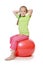 Little girl on a gymnastic ball