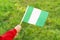Little girl hands hold Nigeria flag