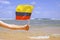 Little girl hands hold Venezuela flag against the sea horizon