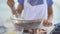 Little girl hands mixing chocolate dough